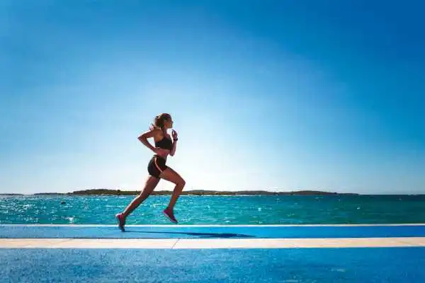 Woman running showing strong leg muscle Wolverhampton